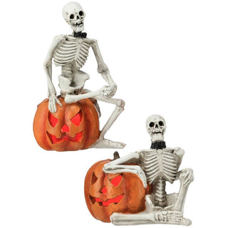 Skeleton Sitting on Pumpkin